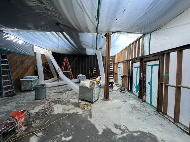 Interior containment prepared for regulated material removal