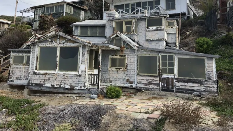 Weathered painted exterior surfaces on an existing residential building