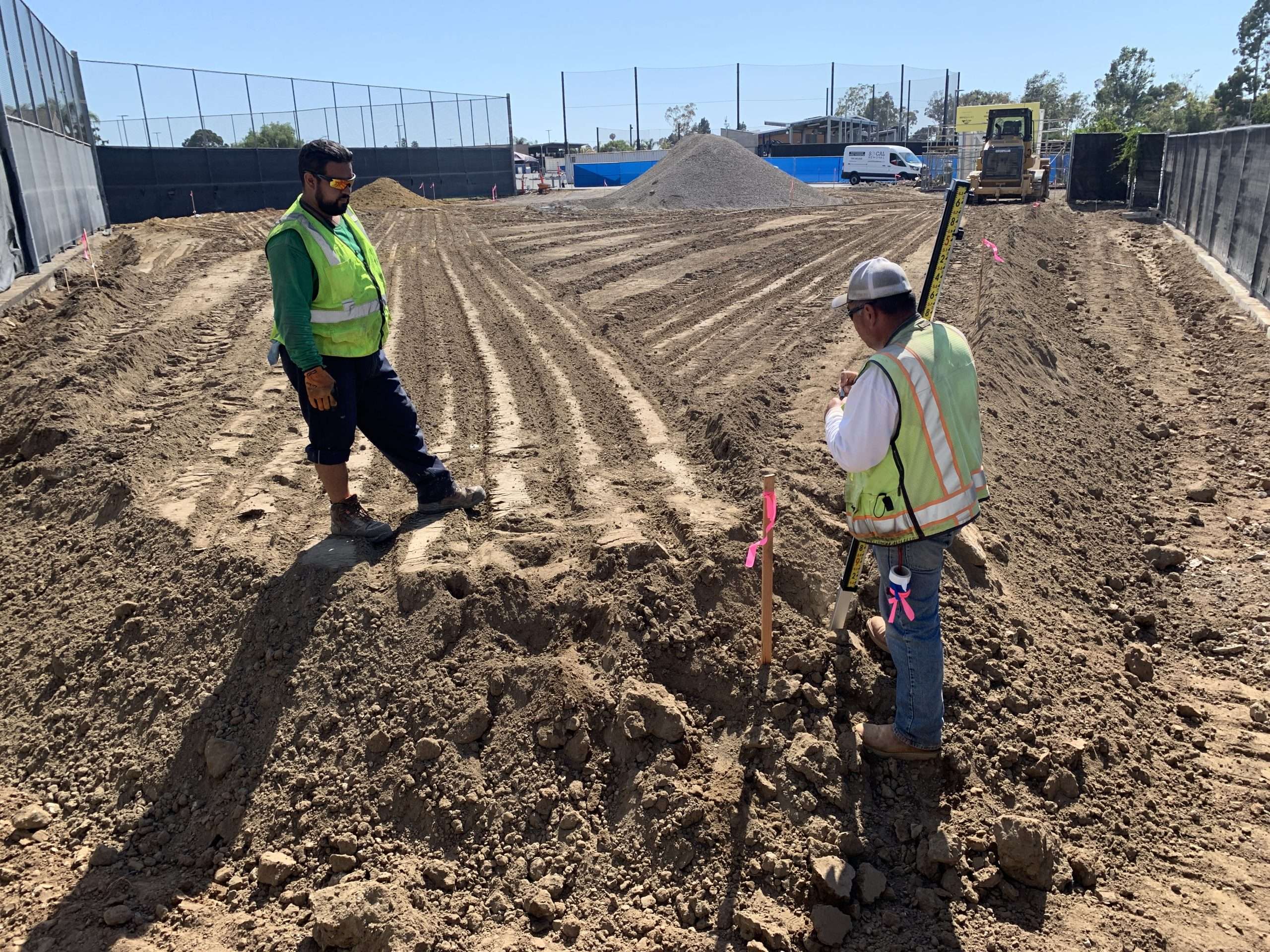Field photograph of the site before the depicted grading and earthwork activity.