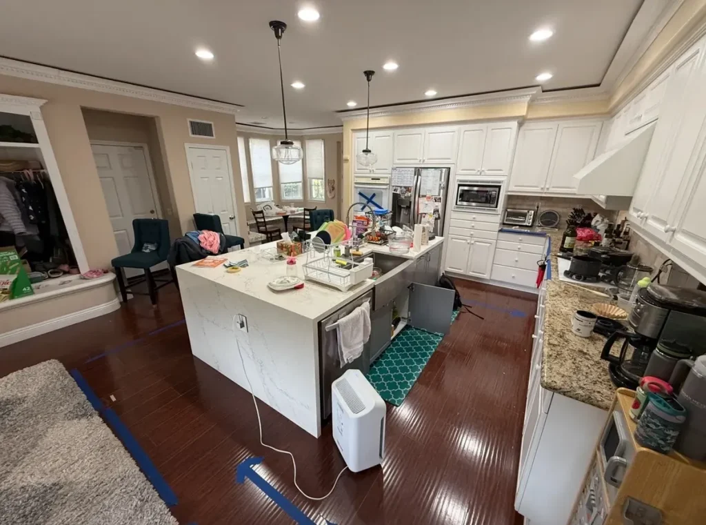 Irvine kitchen island before removal of leak-damaged cabinetry