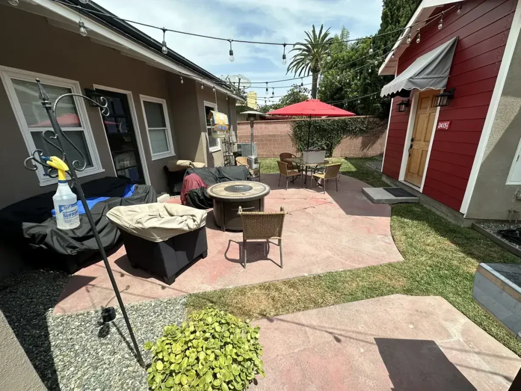 Concrete pavement and short block wall before selective demolition